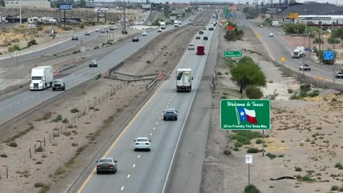 Welcome to Texas sign along interstate highway in desert region. American Stock Footage 245692094