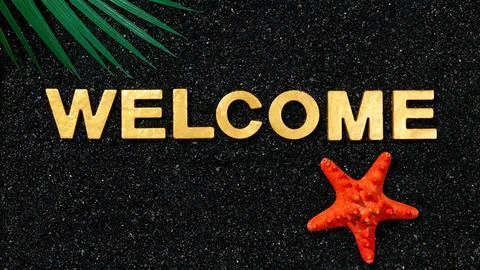Welcome - Text in black sand Stock-Fotos