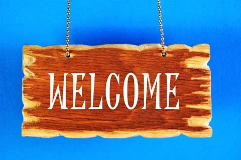 Welcome. Text caption on the background of a vintage sign banner. Stock Photos