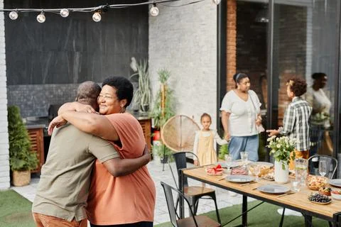 Welcoming Guests at Family Gathering Stock Photos