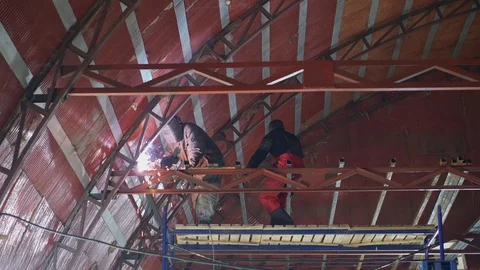 Weld welding metal construction on scaffolding Stock Footage 104222885