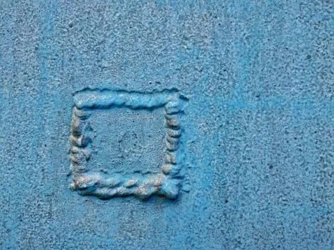 Welded patch to cover a hole in a blue metal plate Stock Photos