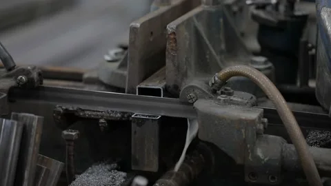 Welded seam on a section of a steel pipe with the help of a grinding machine in Stock Footage 142889597