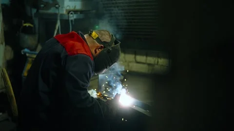 Welder in action, welding process, metalworks with sparks Stock Footage 274490357