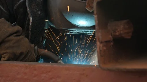 The welder brews metal in the corner of the hold, on the ship Video stock 87393129