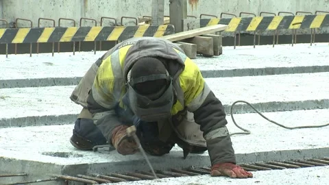 Welder on the bridge welds support, Electrode welding Video stock 104015929