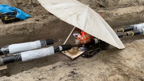 Welder at construction site of district heating network Stock Footage 301904337
