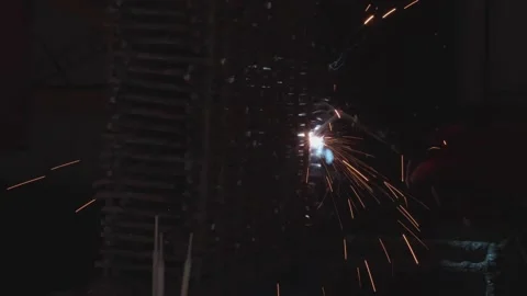Welder cooks iron structure at construction site Stock Footage 132492735