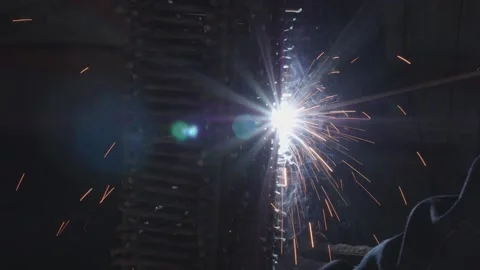 Welder cooks iron structure at construction site Stock Footage 132492826