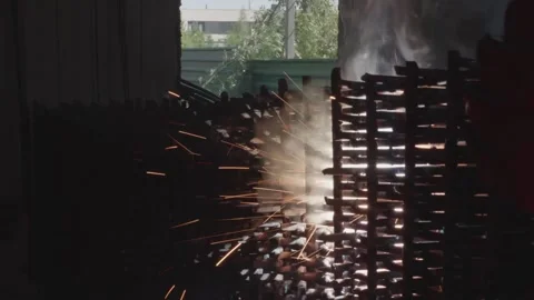 Welder cooks iron structure at construction site Stock Footage 132492945