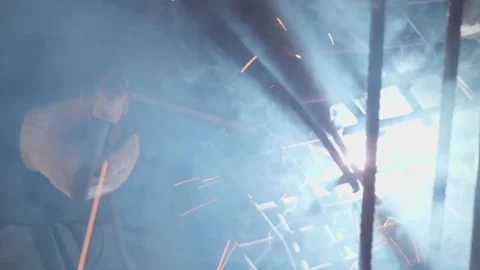 Welder cooks iron structure at construction site Stock Footage 132493005