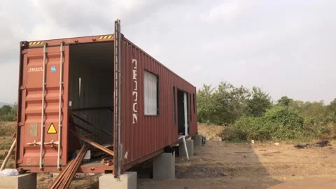 Welder cutting window marking of a shipping container, in Acrra, Ghana Stock Footage 312584571