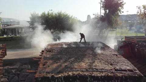 Welder disassembling sunken ship at coast at Maltepe Stock Footage 211094061
