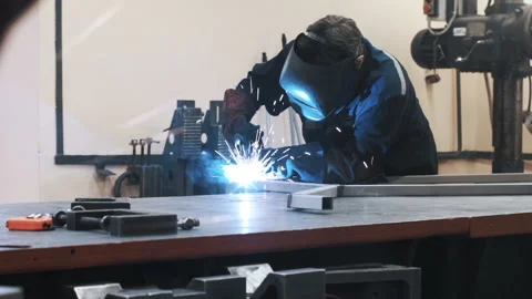 Welder does the work at the factory Stock Footage 95001534
