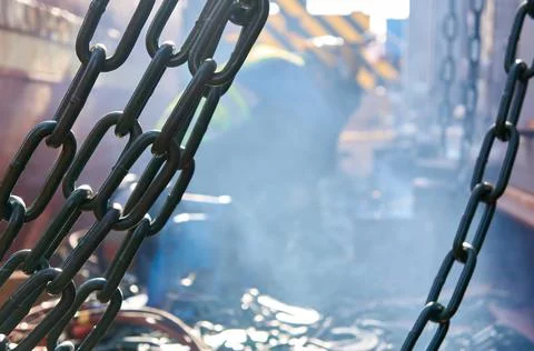 Welder doing welding on deck of ship lashing cargo Stock Photos