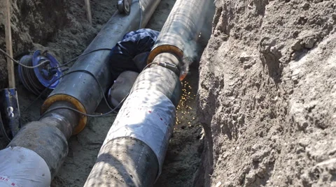 Welder  in the Earthen Trench Stock Footage 67866616