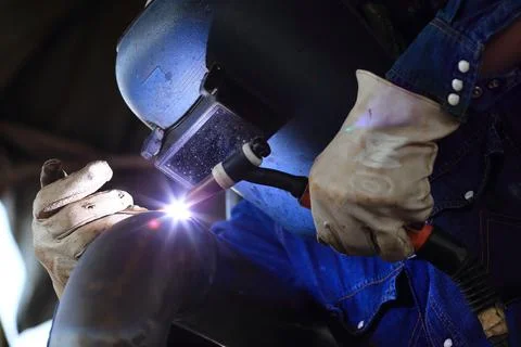 Welder at factory work Stock Photos