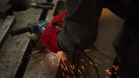 Welder Grinding Metal with Angle Grinder in Industrial Workshop Stock Footage 342512534