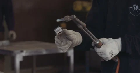 Welder lighting a cutting torch Stock Footage