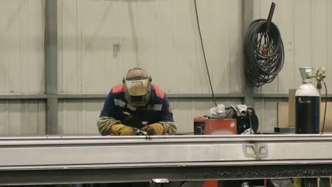 Welder man in a protective mask performs welding work. Stock Footage 131341435