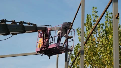 Welder on mobile platform, welder is welding on the mobile platform Stock Footage 165846130