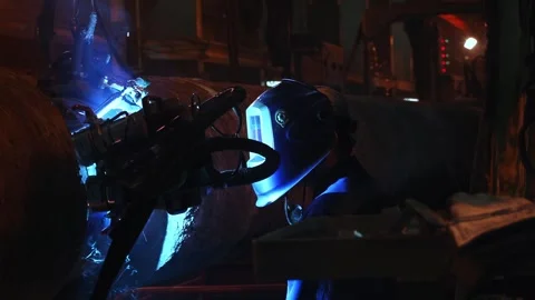 Welder Monitors Mechanized Welding Head on Large Diameter Steel Pipe Joint Stock Footage 341651891