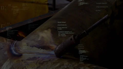 Welder operating welding torch on metal pipe in fabrication shop, showing Stock Footage 308101051