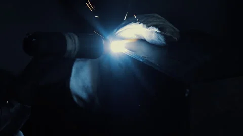 Welder performing TIG welding with bright arc light, Close-up of gloved hands Video stock 309317265
