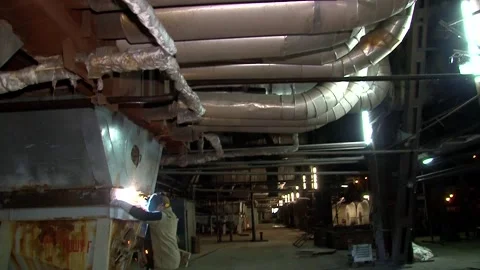 A welder performs equipment repairs at a thermal power plant Stock Footage 295367942