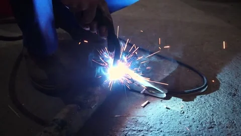 The welder performs welding works of metal Stock Footage 221433911