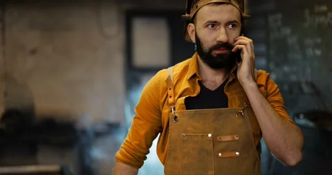 Welder with phone at the workshop Stock Footage 147295278