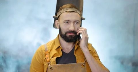 Welder with phone at the workshop Stock Footage 147295820