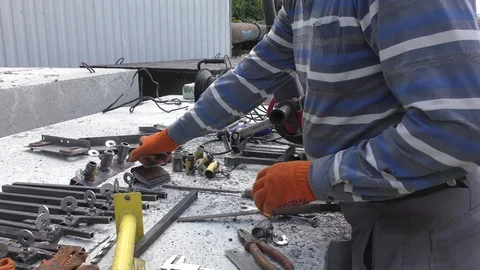 The welder prepares his workplace. Stock Footage 116130004