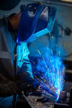 Welder with protective mask Stock Photos