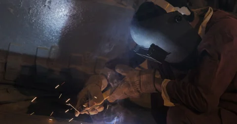 Welder With Protective Mask Working In A Steel Factory (4K) Stock Footage 60767657