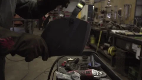 Welder Puts on Mask Video stock 84685479
