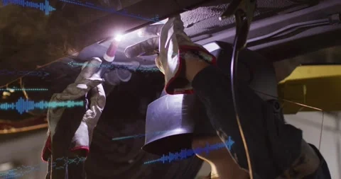 Welder raising torch, igniting arc, welding, repairing auto underbody, blue HUD Stock Footage 330191122