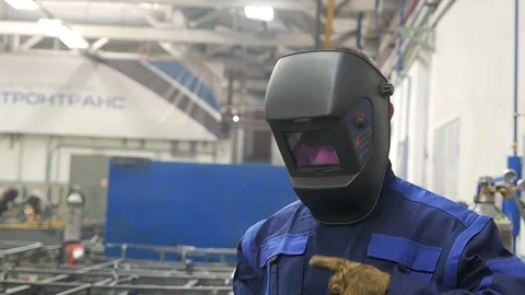 Welder removes mask Stock Footage 94042288