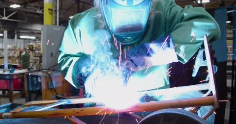 Welder running a bead with sparks Stock Footage 199669231