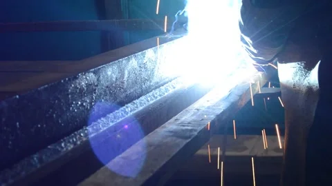 Welder uses torch to make sparks during manufacture of metal equipment Stock Footage 148035141