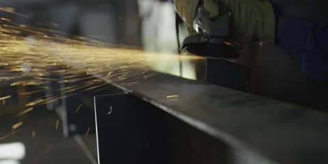 Welder using circular saw in workshop Stock Footage 67023725