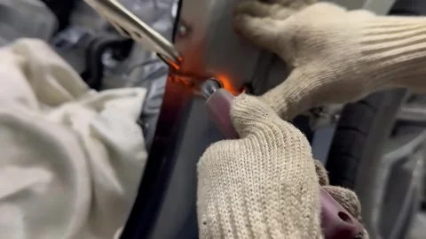 Welder Using MIG Torch on Car Body Panel With Blue Arc and Sparks Видео 348691412