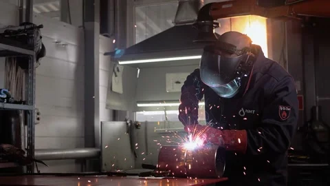 Welder wearing sunglasses performs welding work in the shop. Stock Footage 212403884