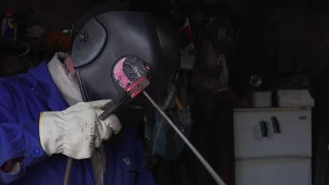 A welder weld metal in the workshop Stock Footage 104262815