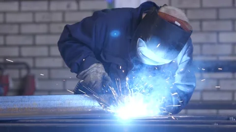 Welder welding metal Stock Footage