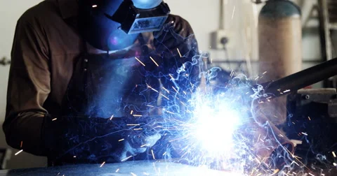 Welder welding a metal Stock Footage 69158384