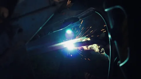 Welder welding a metal in workshop Stock Footage 80022130