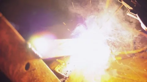 Welder welding a metal in workshop Stock Footage 80022230