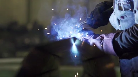 Welder welding a metal in workshop in slow motion Video stock 73021094