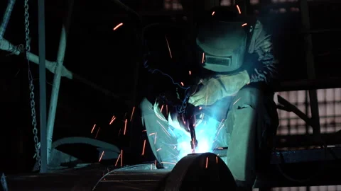 Welder welding metalwork in a factory Stock Footage 100607997
